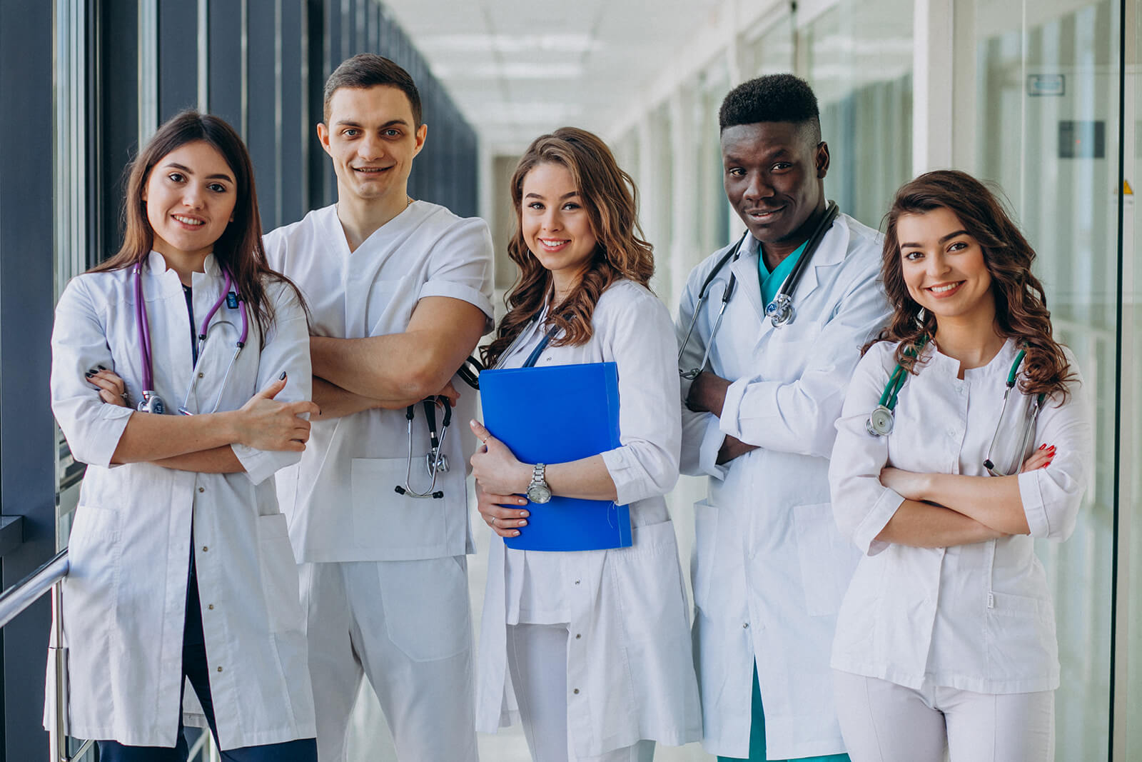 team-young-specialist-doctors-standing-corridor-hospital